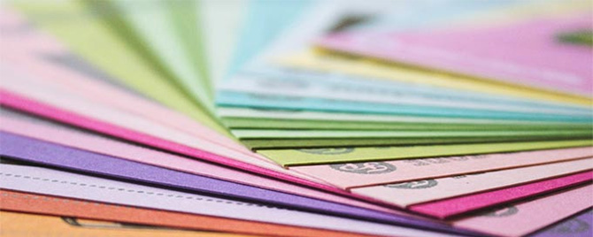 photo - closeup of colorful paperwork spread across a table