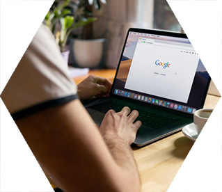 photo - close up of someone looking at a Google search window on a laptop
