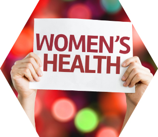 photo - a pair of hands holds up a sign that reads 'WOMEN'S HEALTH'