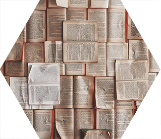 photo - a pile of books, all open