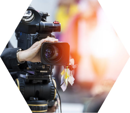 photo – closeup of a person using a video camera