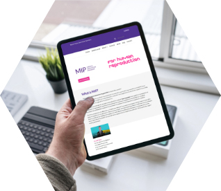 photo - a hand holding a tablet device with the MIP Human Reproduction innovation portal displayed on it