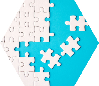 photo - a white jigsaw puzzle being constructed on a teal background