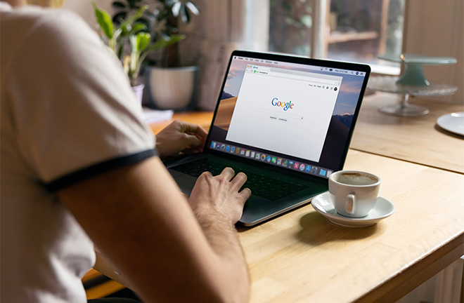 photo - close up of someone looking at a Google search window on a laptop