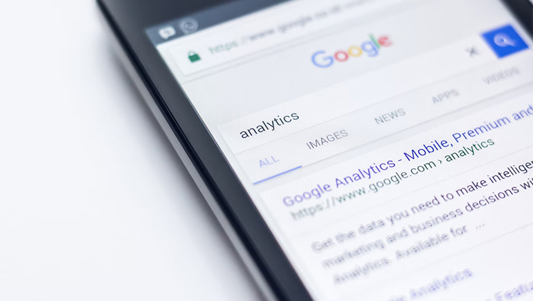 photo - closeup of a smartphone displaying a Google analytics screen